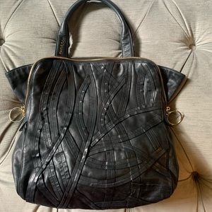 Paule Ka top handle leather bag